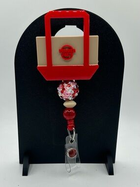 Trader Joe's Red and Cream Beaded Badge Reel